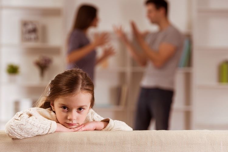 parents arguing in front of child